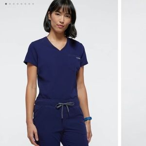 Jaanuu women’s navy scrub top
